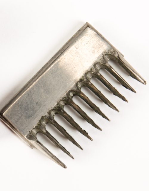 A steel clipper comb attachment