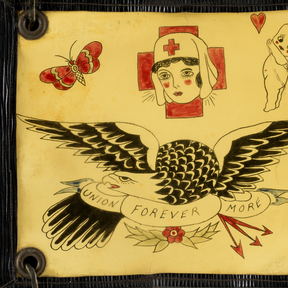 A hand-painted flash sheet: a nurse's head, a kewpie figure and a lettered eagle, drawn in rows.
