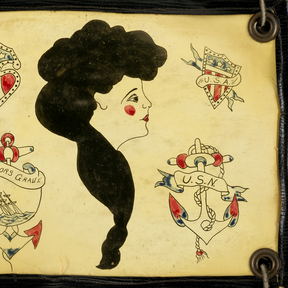 A hand-painted flash sheet: a lettered anchor, a second anchor, shields and a profile in silhouette.