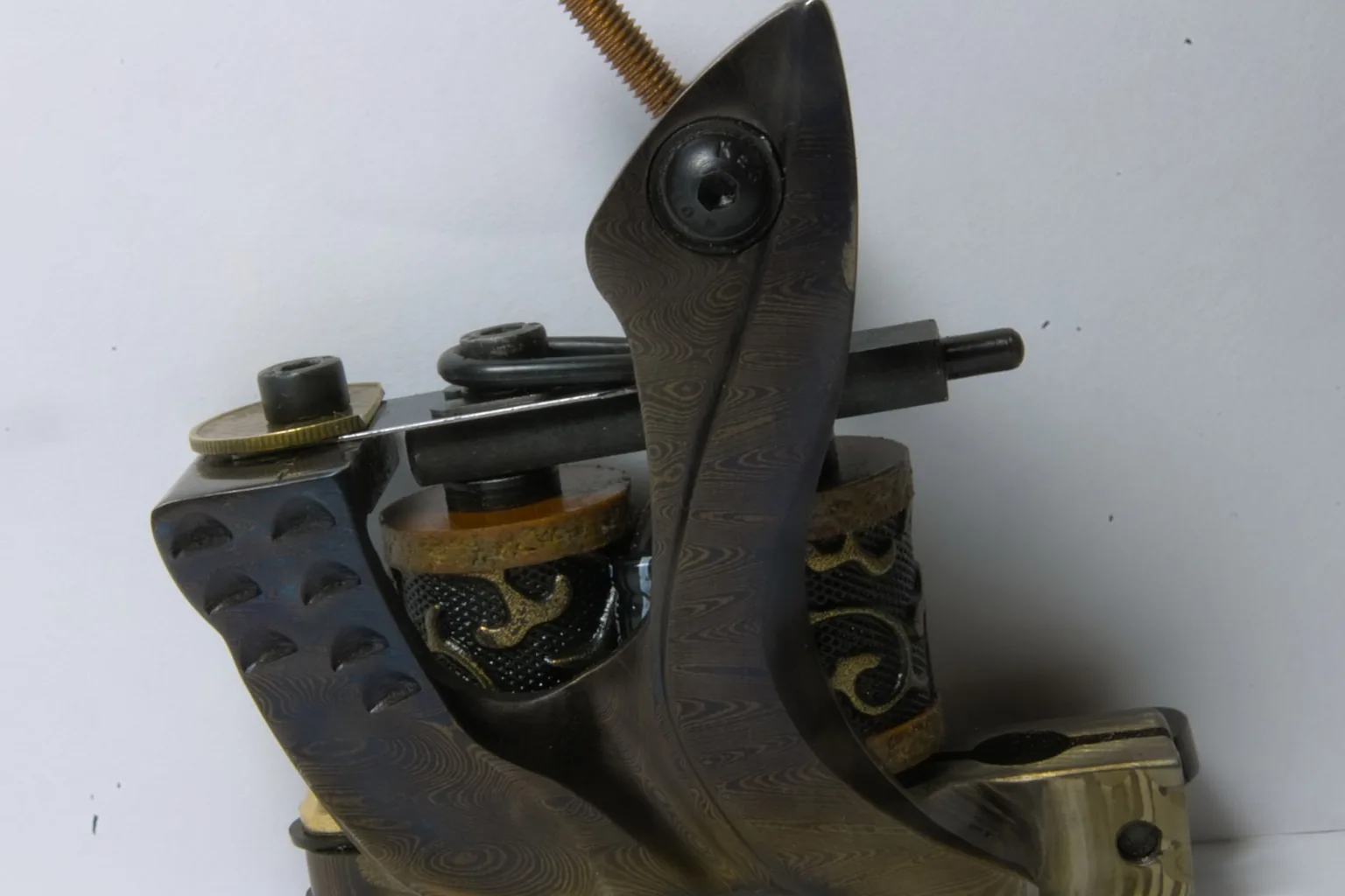 A coil machine laid out on the bench