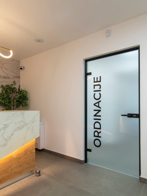 Frosted glass door leading through to the consulting rooms