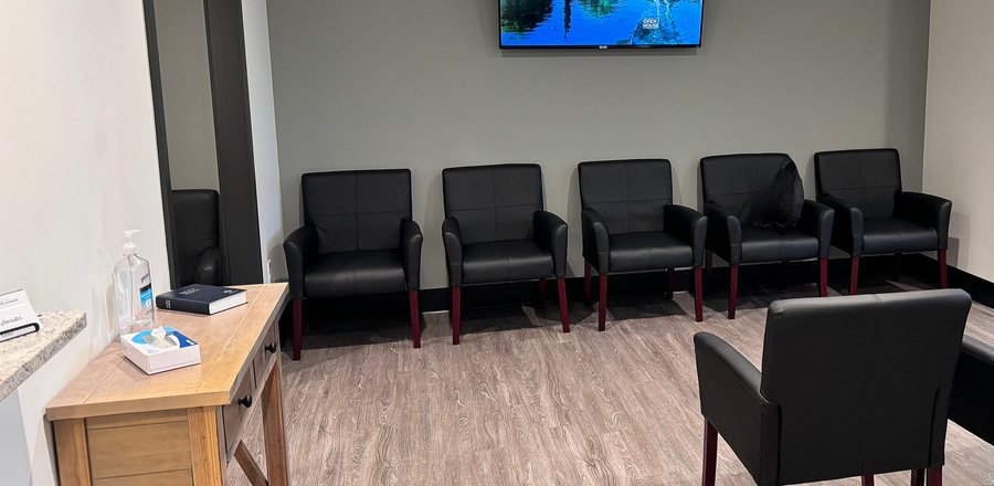 The waiting lounge at the Beaumont suite, with seating along the wall