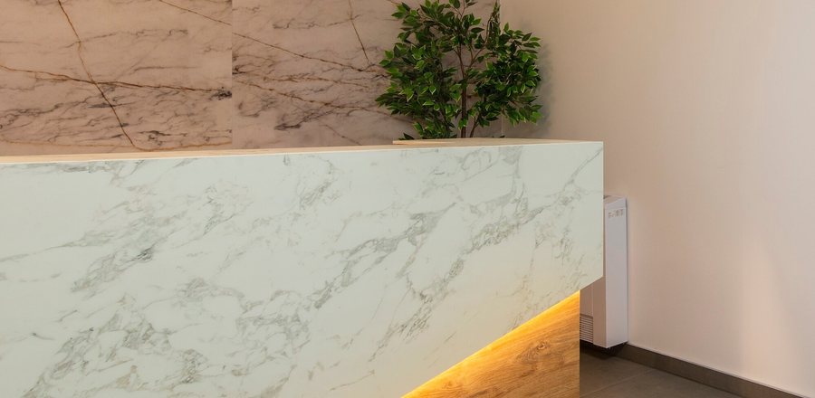 The clinic's marble reception desk at the entrance