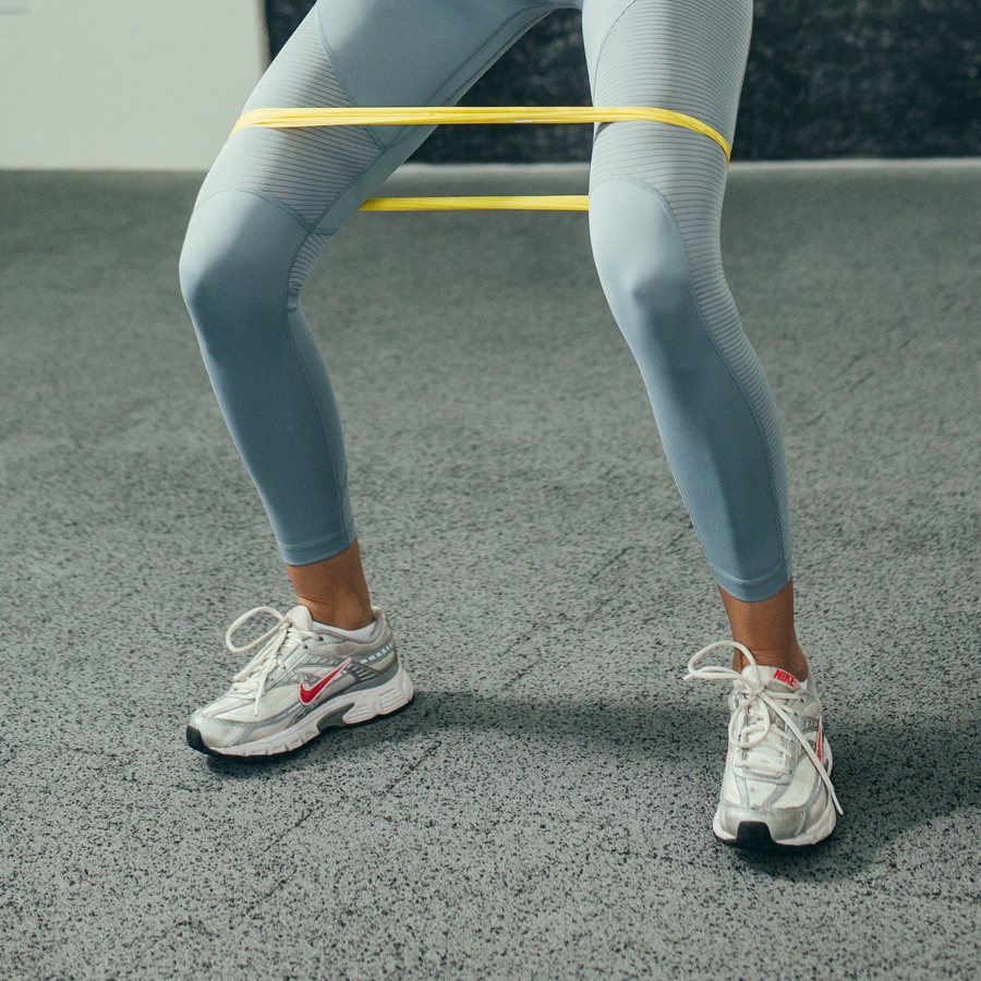 Resistance-band leg work during a rehabilitation session