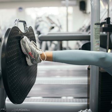 A leg-press footplate in use during a supervised strength session