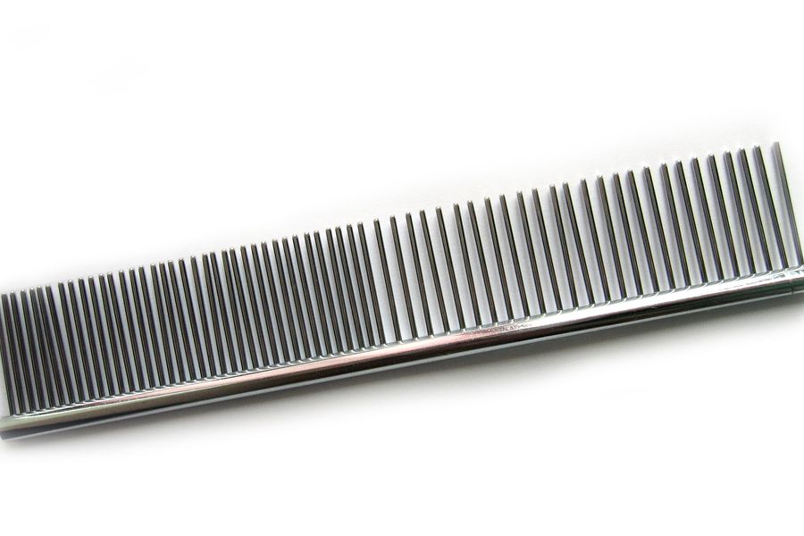 A steel grooming comb.