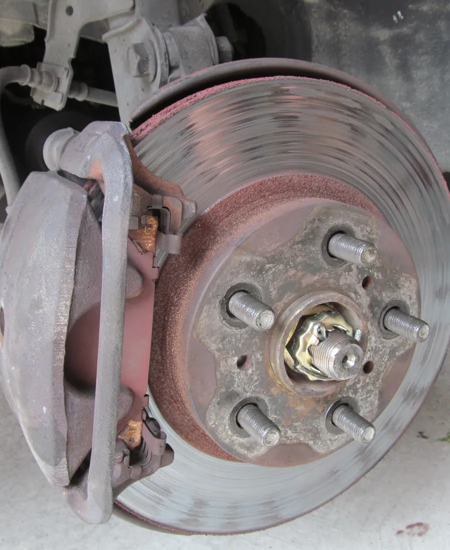 Close crop of a brake disc and hub with the wheel removed