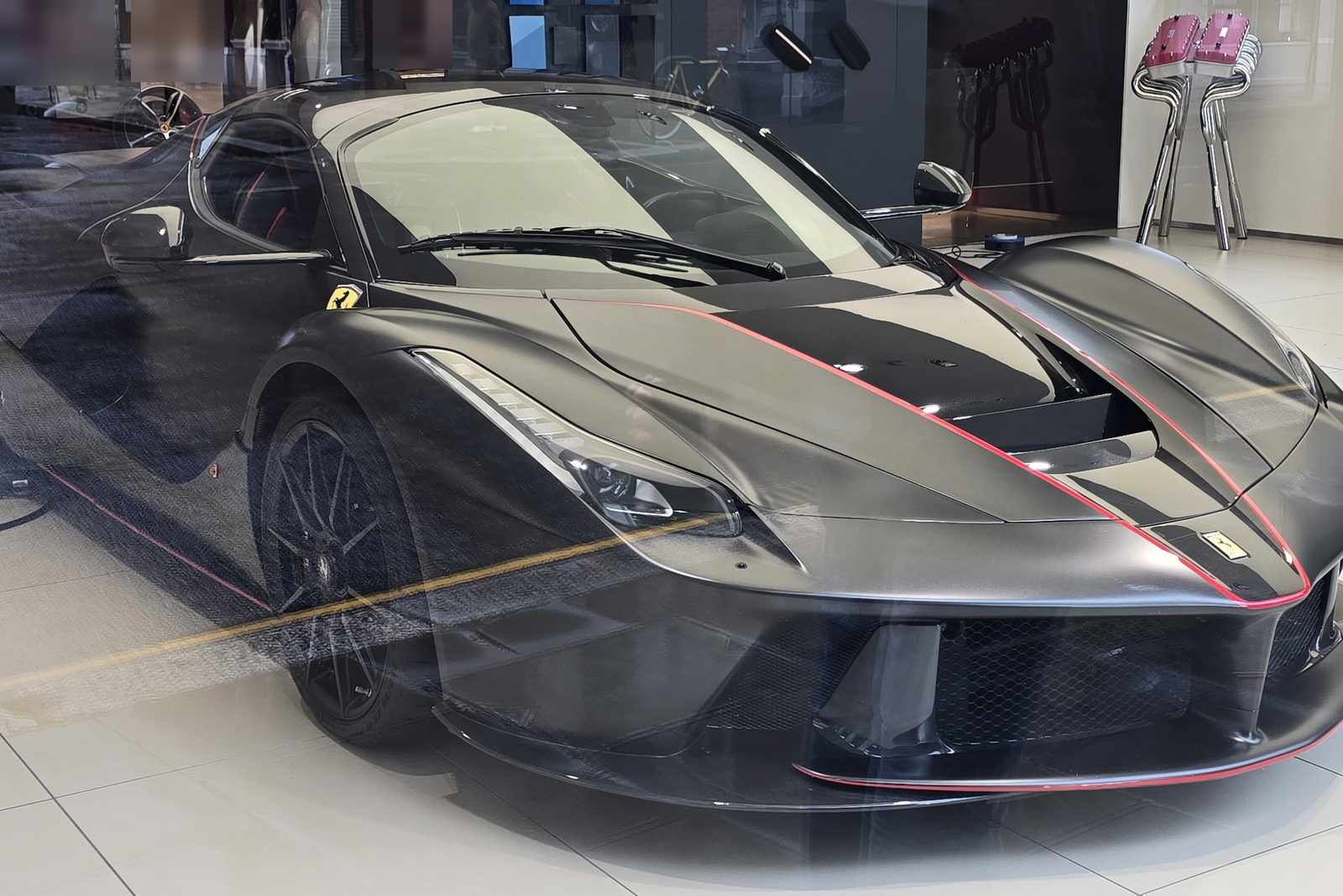 A Ferrari LaFerrari Aperta under showroom light