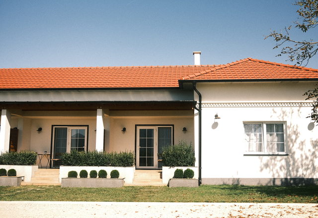 Willow Bend Ranch — single-storey ranch house with a red roof and landscaped garden