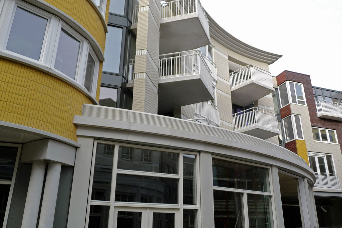 New mid-rise apartment buildings with balconies