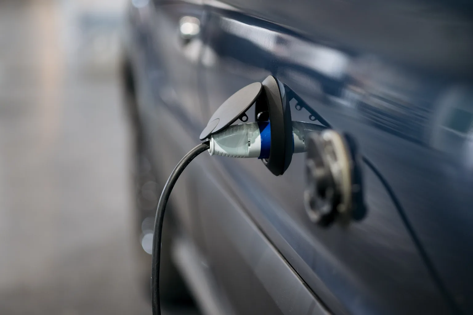 A charging lead connected to a car inlet once the home charge point has been commissioned.