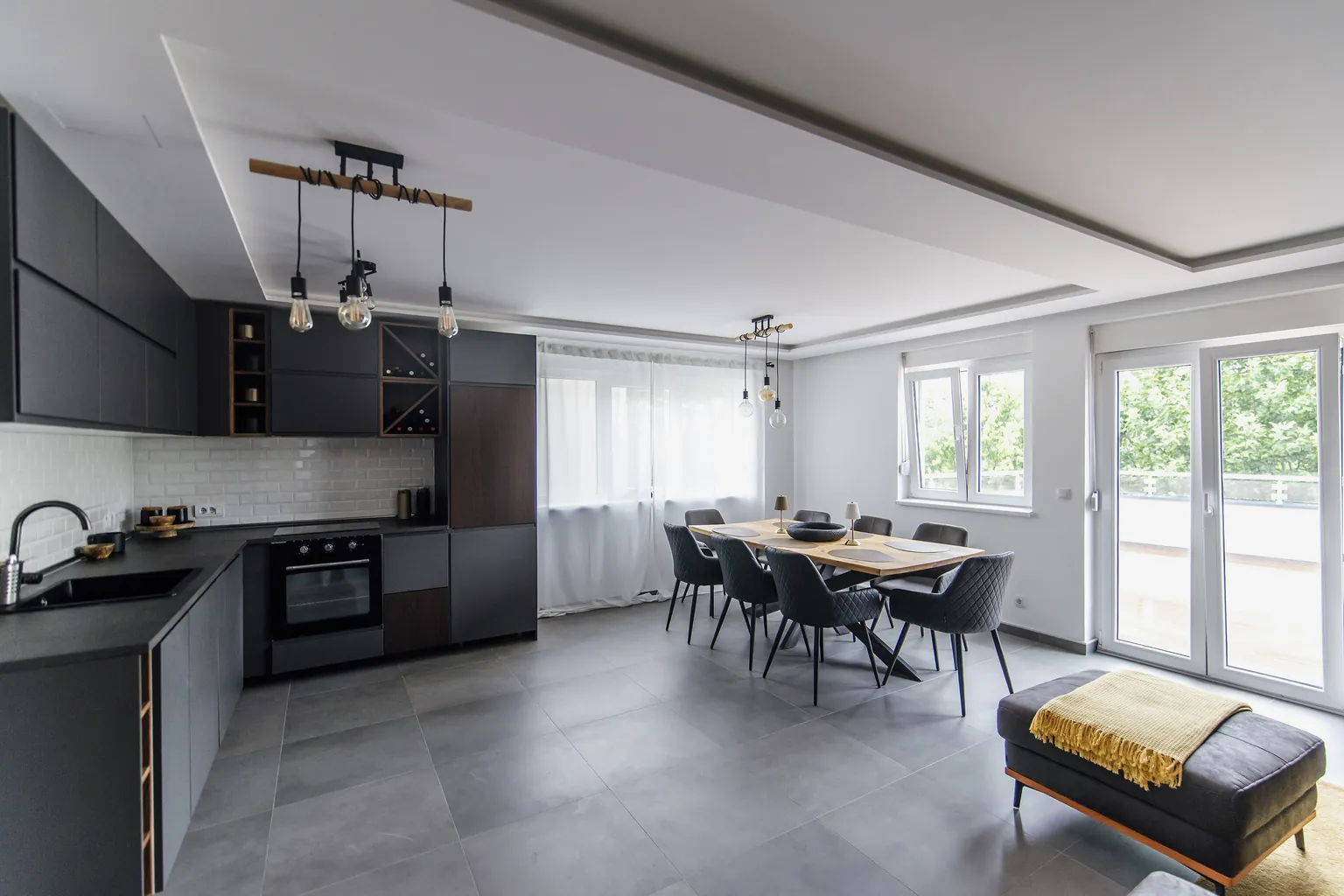 Kitchen and dining area with cleared counters and swept floor