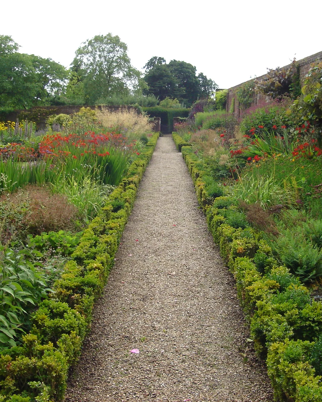 A long perennial border seen down the length of a path