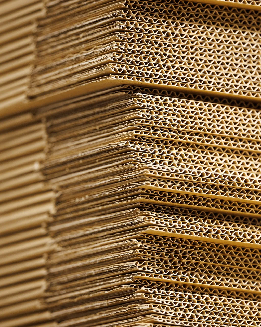 A vertical study of stacked packing cartons.