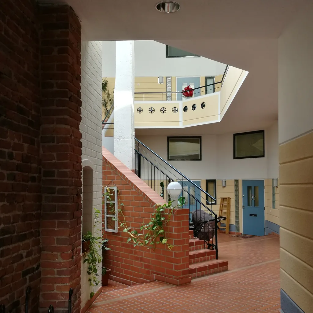 An apartment stairway and landing on a carry route