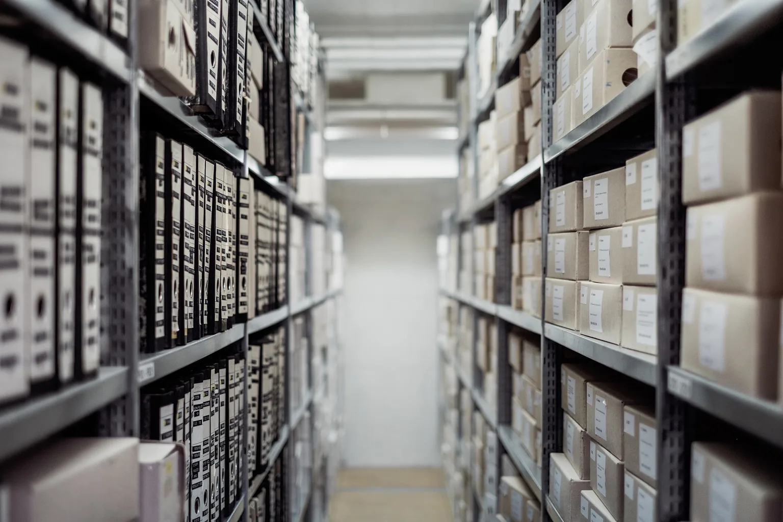 A storage aisle with shelved boxes and clear access