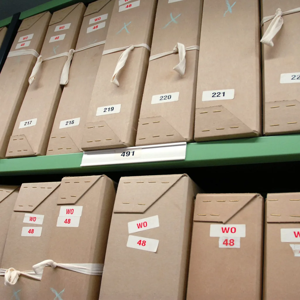 Archive boxes arranged in numbered order on a shelf