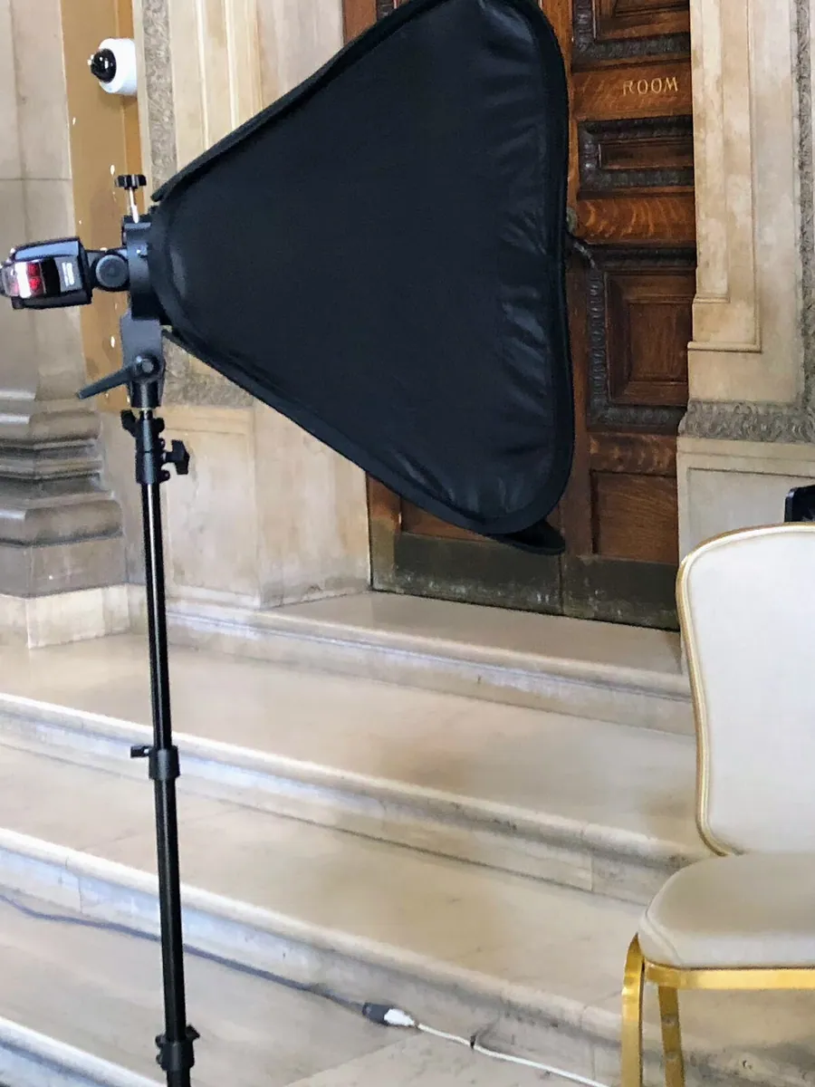 Close crop of a softbox and chair on a location portrait set