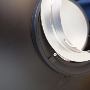 Close-up of a speedring seated in the mouth of a reflector dish