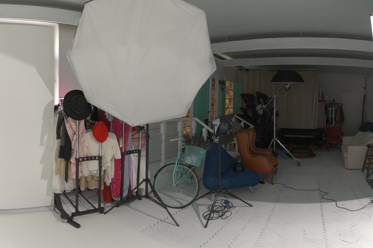 Wardrobe rail and studio lighting set for an editorial fashion shoot