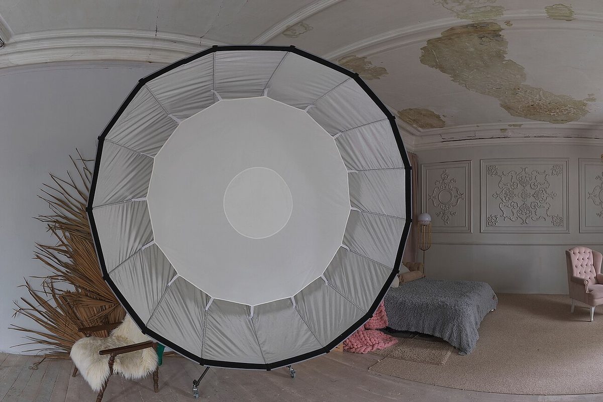 Large parabolic softbox lighting the headshot corner of the studio