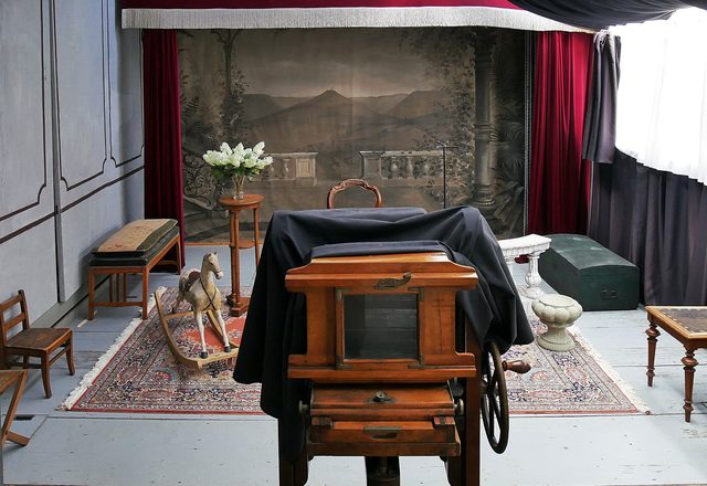 Studio camera in front of a painted backdrop