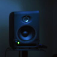 A small monitor in blue light with a green LED.