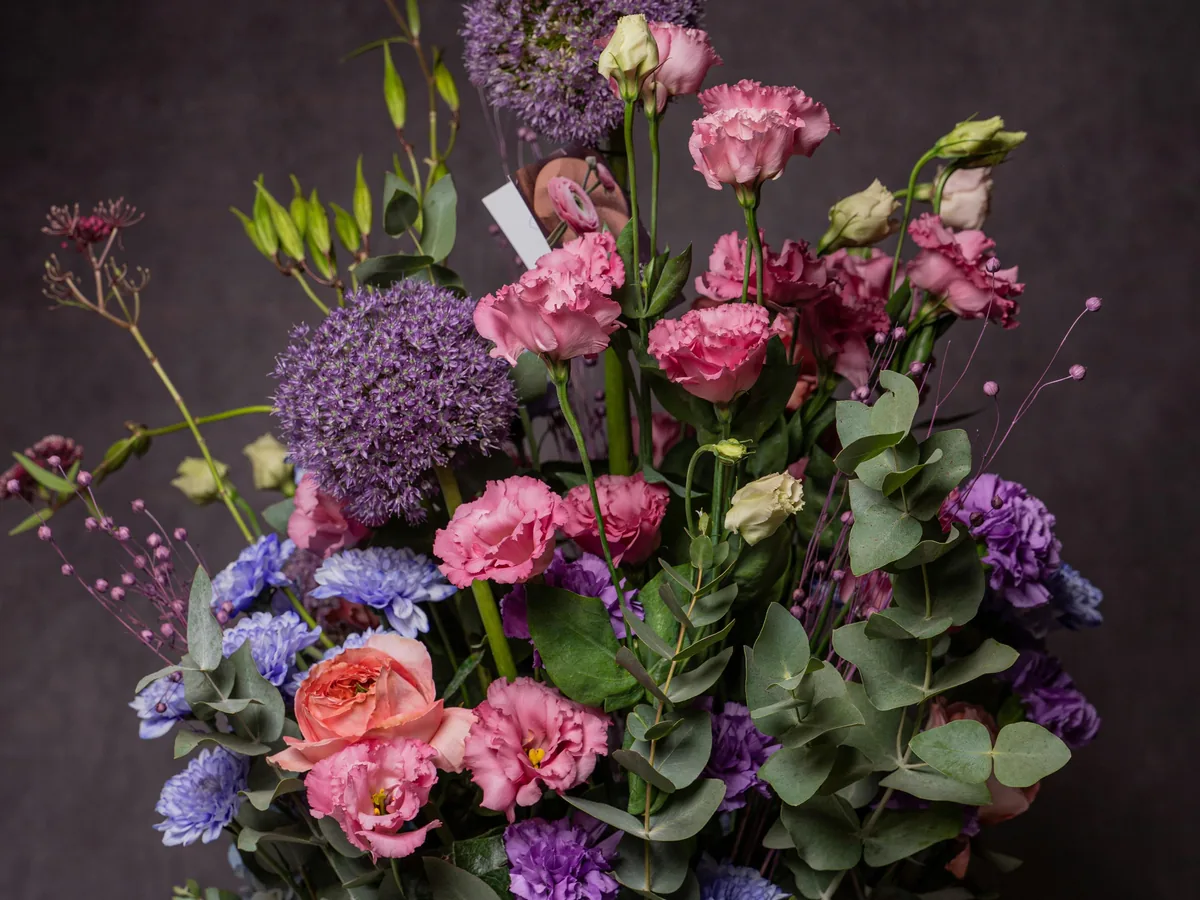 Rose, carnation and allium hand-tied arrangement in a blush box